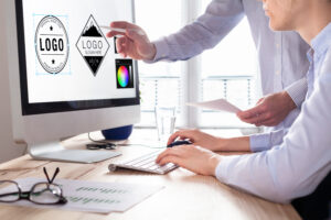 someone creating logo deign on a computer