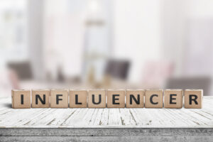 influencer sign on wooden table