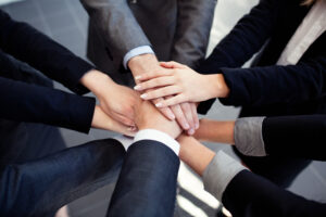 business people joining hands