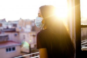 gen z girl wearing a mask in quarantine