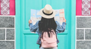 young female tourist looking at map