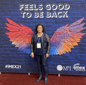 posing-in-wings-mural-at-imex