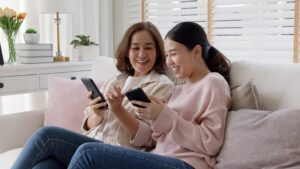 asian family sit sofa couch living room enjoy life 