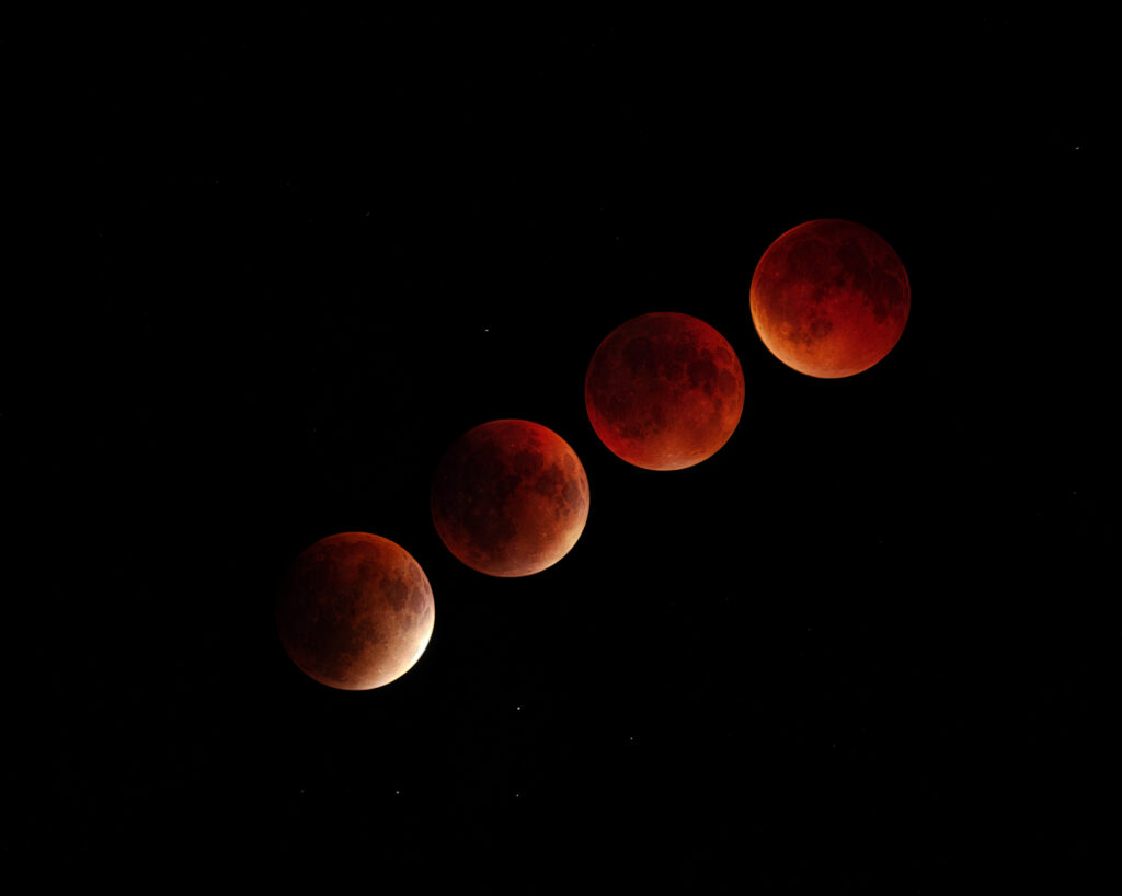 Phases of a blood moon during lunar eclipse, a stunning astrotourism experience for travelers interested in night sky viewing.