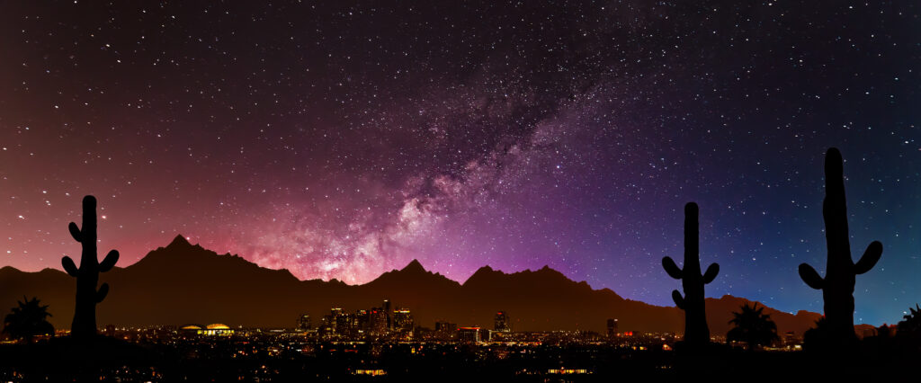 A beautiful Phoenix skyline showcasing the milky way and a view of the city.