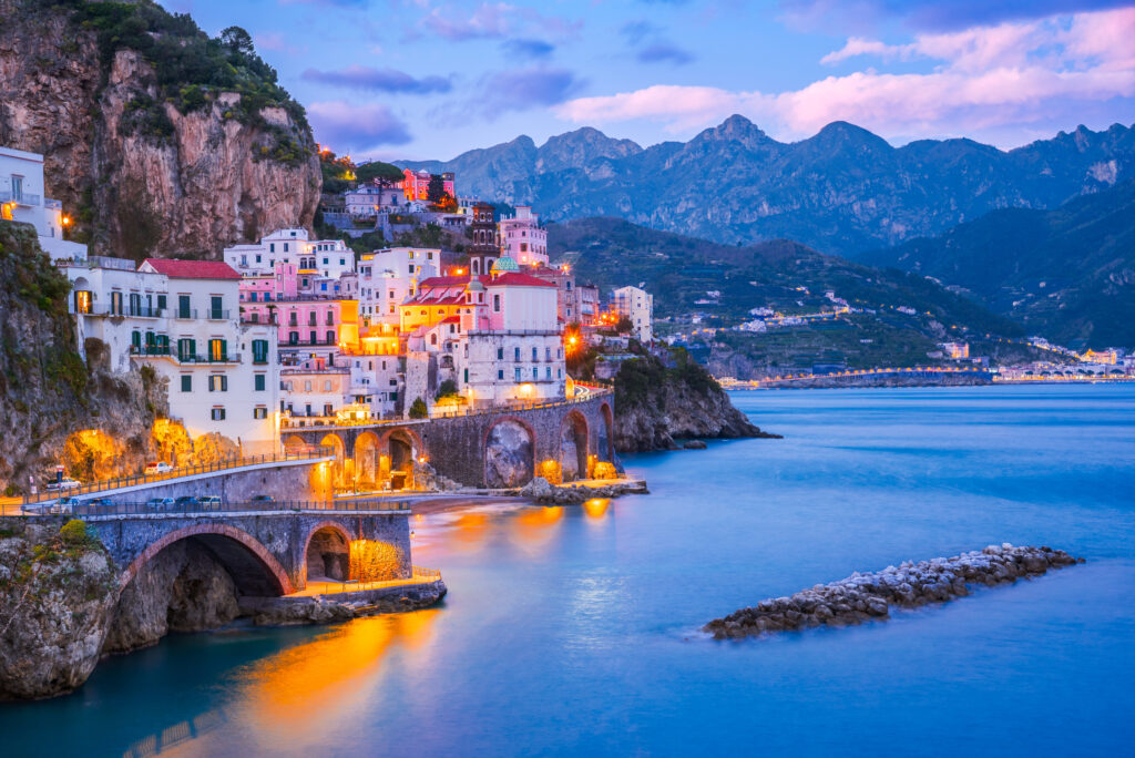 A scenic night view of the Atrani cityscape on the coast line of the Tyrrhenian Sea in the Mediterranean.