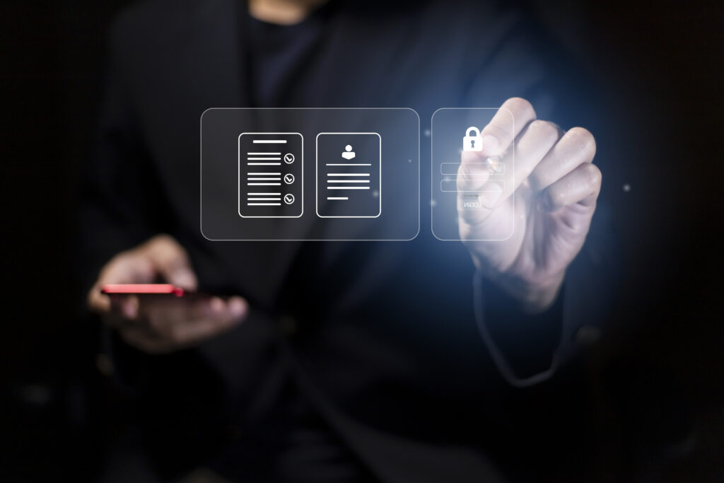 A dark image of someone using a stylus on a screen that showcases a lock screen.